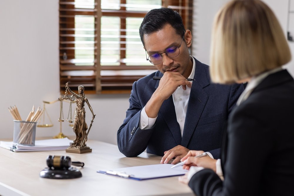 Criminal Lawyers Discussing The Case With Collegue