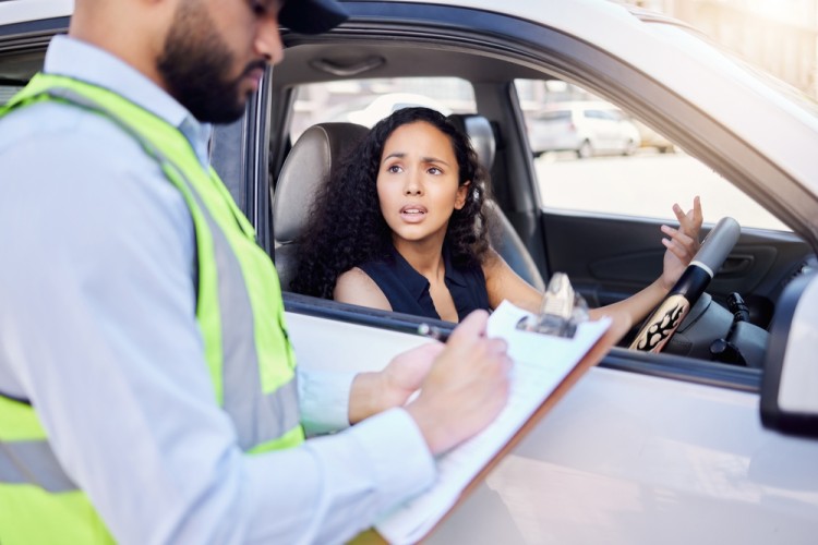 Police Investigating A Woman On Traffic Offence